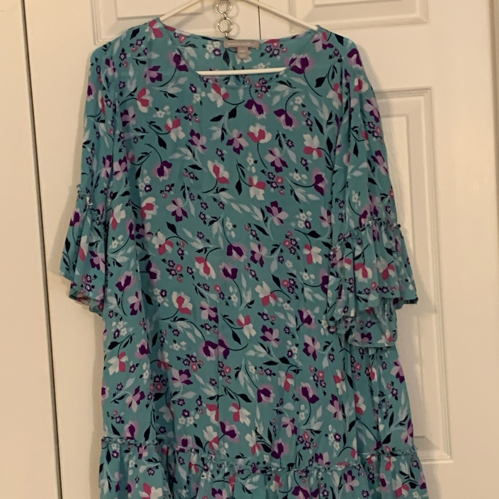 Aqua tunic length blouse with flounce sleeves. Lightweight gauze material